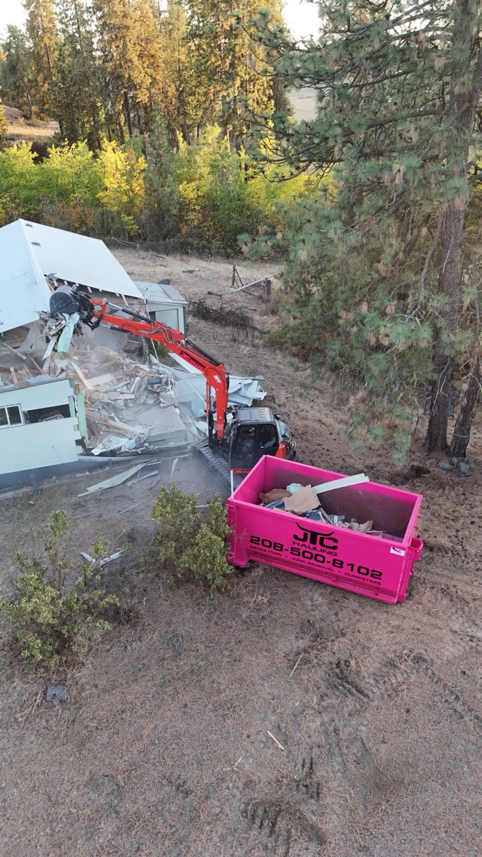 Overhead drone view of a demolition site with JTC equipment